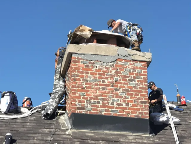 Willoughby Chimney Sweep installing a custom chimney crown in Willoughby, OH