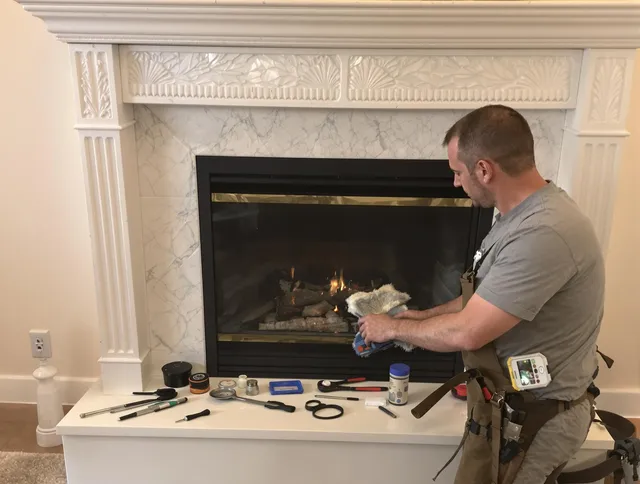 Willoughby Chimney Sweep performing fireplace maintenance in Willoughby, OH